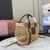 Woven fabric handbag with leather trim
