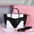 Black with white leather handle bag