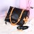 Black with beige leather bow-tie handle bag