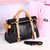 Black with beige leather bow-tie handle bag