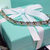 Tiffany & Co. Gold cross silver rhinestone bracelet