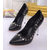 Black leather rivet pump