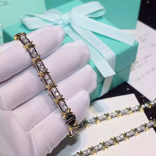 Tiffany & Co. Gold cross silver rhinestone bracelet