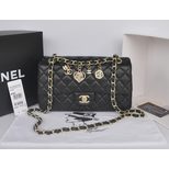 Chanel Original black leather camellia charm flap bag